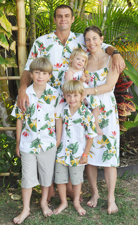 Family in matching Bird of Paradise Display Hawaiian outfits, from dad's shirt to keiki sizes