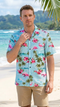 Man on a beach in the RJC Pink Flamingo Hibiscus men's Hawaiian shirt in blue