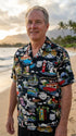 Man on the beach at sunset in the Route 66 Travel Sights men's shirt in black