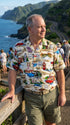 Man at an ocean overlook in the Route 66 Travel Sights Hawaiian shirt in khaki