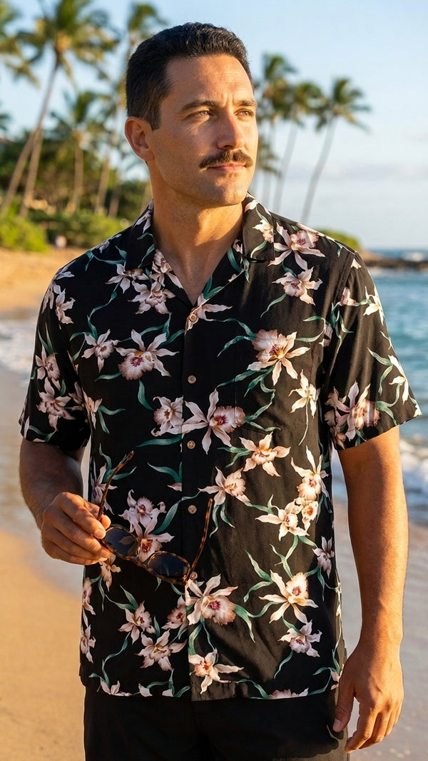 Man at sunset on the beach in the black Star Orchid rayon Hawaiian shirt